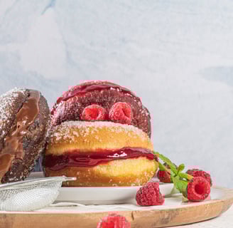 a plate with a variety of pastries on it