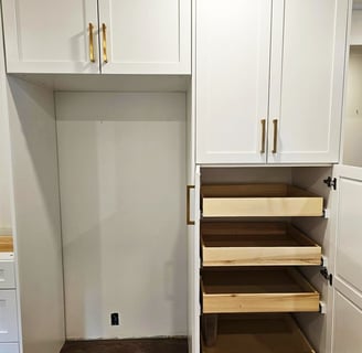 a kitchen with a pantry with white shaker cabinets and drawers