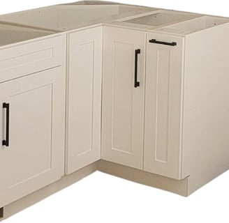 a kitchen with a lazy Susan white shaker cabinet