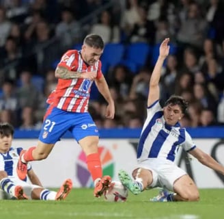 a soccer player is kicking a soccer ball