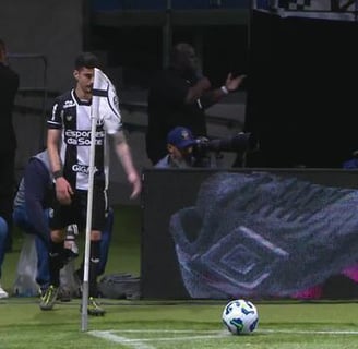 a soccer player is playing soccer on a field