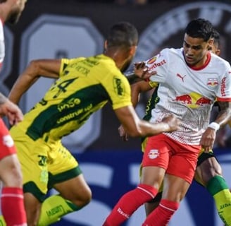a soccer player is playing soccer in a stadium