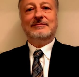 Alberto Barbieri in a suit and tie with a tie