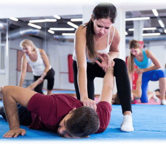 3 women blocking 3 men using self defence techniques