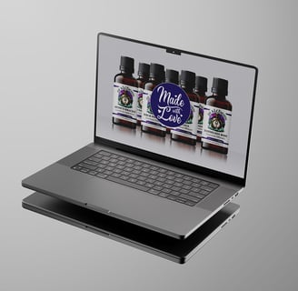 a laptop computer with PJ Alchemy website on