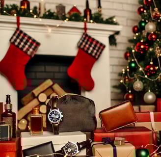 Luxury Christmas gift ideas for boyfriend, including a sleek tie set, Bluetooth speaker, and stylish