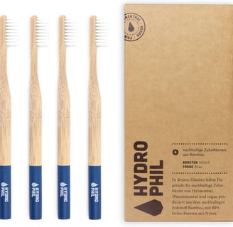 a set of three bamboo toothbrushes with a box of toothbrushes
