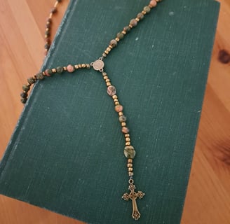 a rosary necklace with a rosary on it