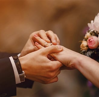 a bride and groom holding hands in a wedding ceremony