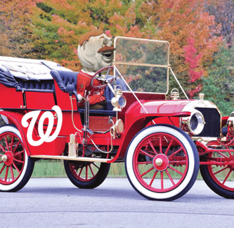 an old car with the Washington Nationals logo and Teddy Roosevelt driving