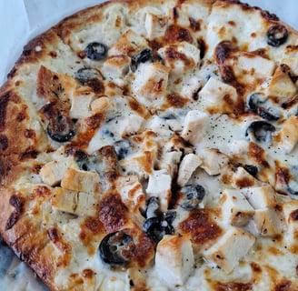 Chicken and black olive pizza