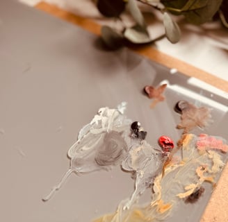 The grey glass palette I use in my painting process