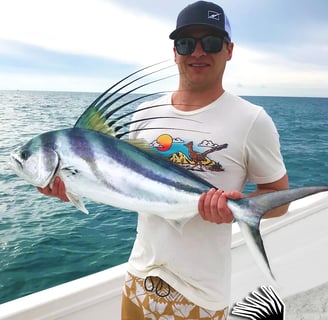 a man holding a fish fish on a boat