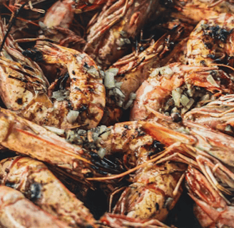 grilled shrimp in a pot with seasoning