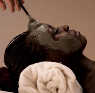 a woman is getting a facial mask with a spoon
