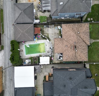 a house with a pool and a tennis court