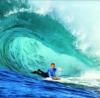 Bodyboarder riding a wave, inspired by Tom Morey’s Boogie Board legacy on Bodyboardingart.com