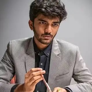a man in a suit and tie is eating a meal
