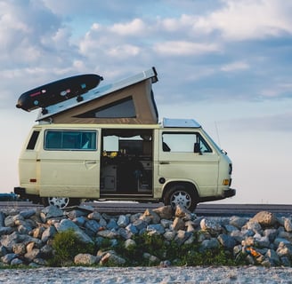 white van under cloudy sky during daytime