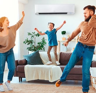 a man and woman playing with a remote control system