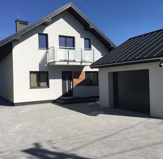 a house with a garage door and a garage door