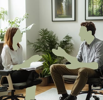 seated man and woman conversing in individual therapy session