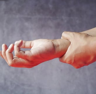 a person holding a hand with a finger on a wrist