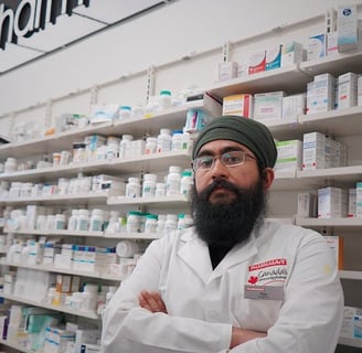 a man in a pharmacy office with a beardless man in a pharmacy