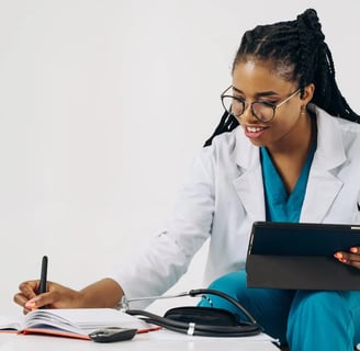 a woman in a lab coat and glasses is holding a tablet computer