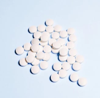 a bunch of pills and pills on a blue background