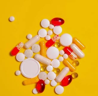 a variety of pills and pills on a yellow background