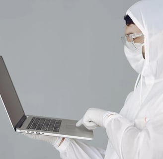 a man in a white lab coat and a white mask