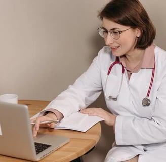 a woman in a white lab coat and a stethrobe