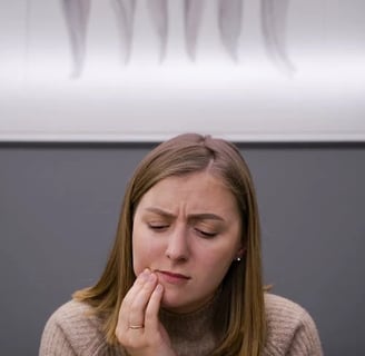 a woman with a toothbrush in her hand and a toothbrush in her hand