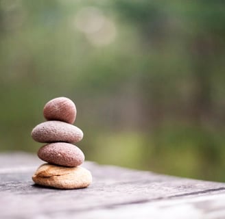 a stack of rocks sitting on top of a wooden table