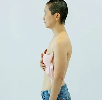 a woman in jeans and a pink bra