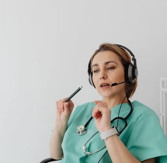 a nurse in a green scrub suit with a stethoscope attached to a