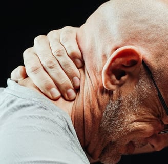 a bald balding man with glasses and a white shirt