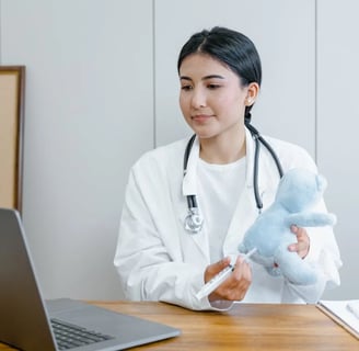 a woman in a white lab coat and stethoscopet