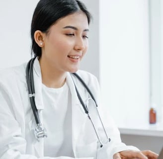 a woman in a white lab coat and a stethrobe