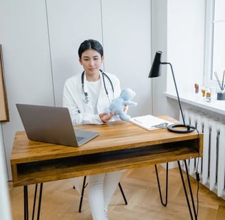 a woman in a white lab coat and a stethoscope