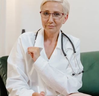 a woman doctor in a white lab coat and glasses