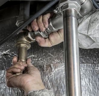 Plumbing business owner meeting with broker