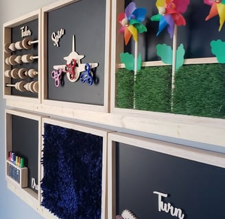 bulletin board with sensory items on wall