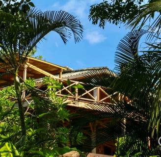wooden bungalow in a tropical garden