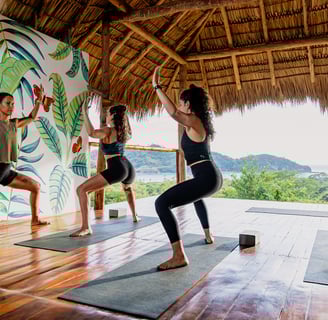 yoga class in yoga shala overlooking the ocean