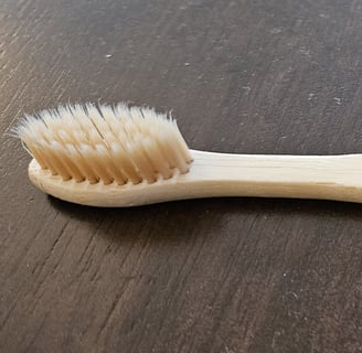 My bamboo toothbrush. An example of my commitment to sustainability.