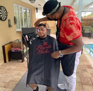"An image showcasing the concept of mobile barbering, where a professional barber provides haircare
