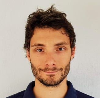 a man with a beard and a blue shirt