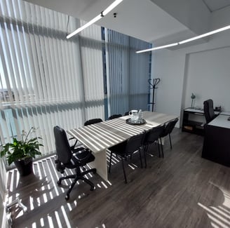 a dining room with a table and chairs